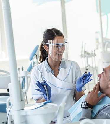 Dentist explaining treatment to patient